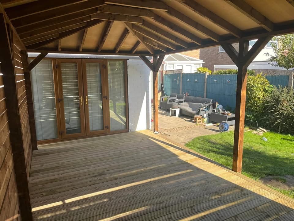 Roof trusses being measured and fitted on a house extension